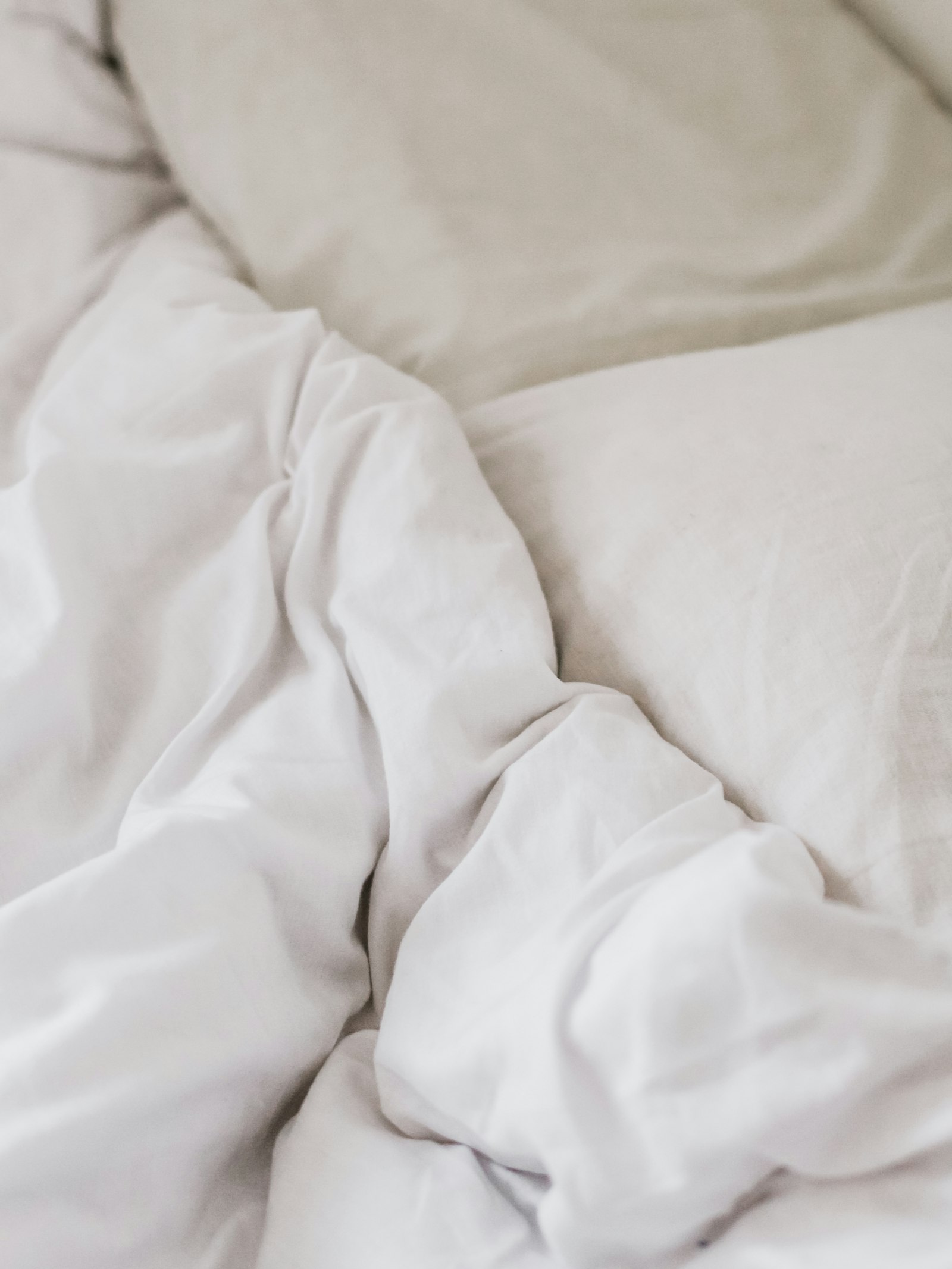Crisp freshly ironed white bedding - Dora Ironing Service
