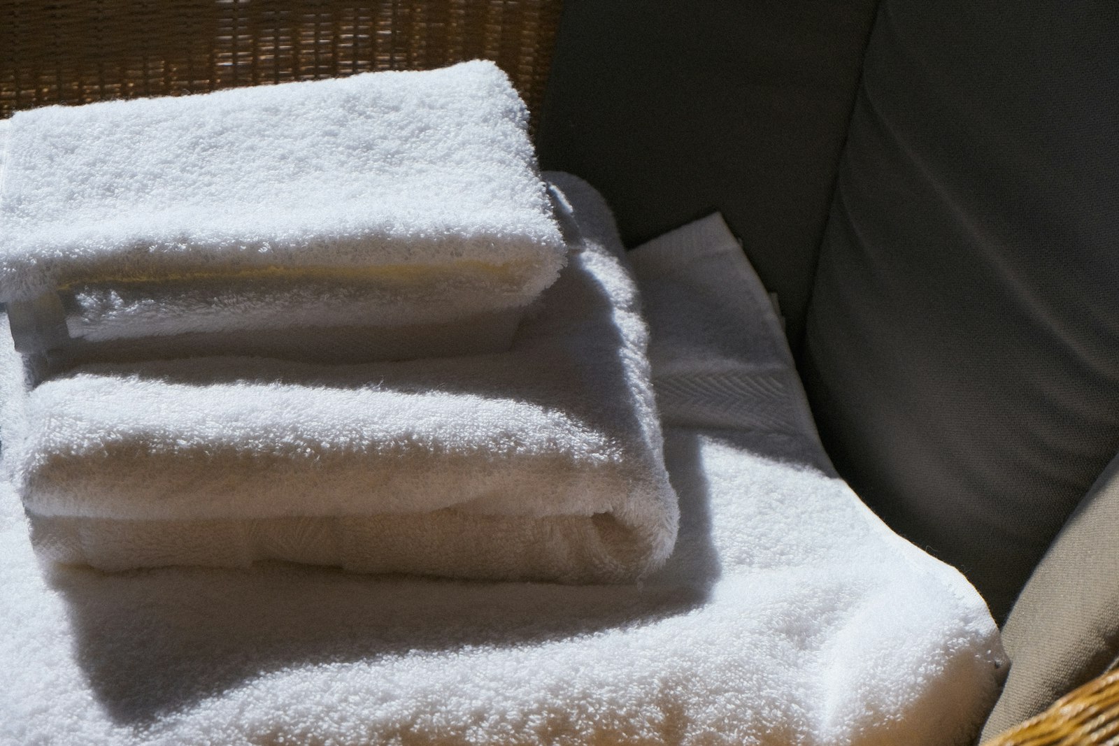 Folded white towels - Dora Ironing Service