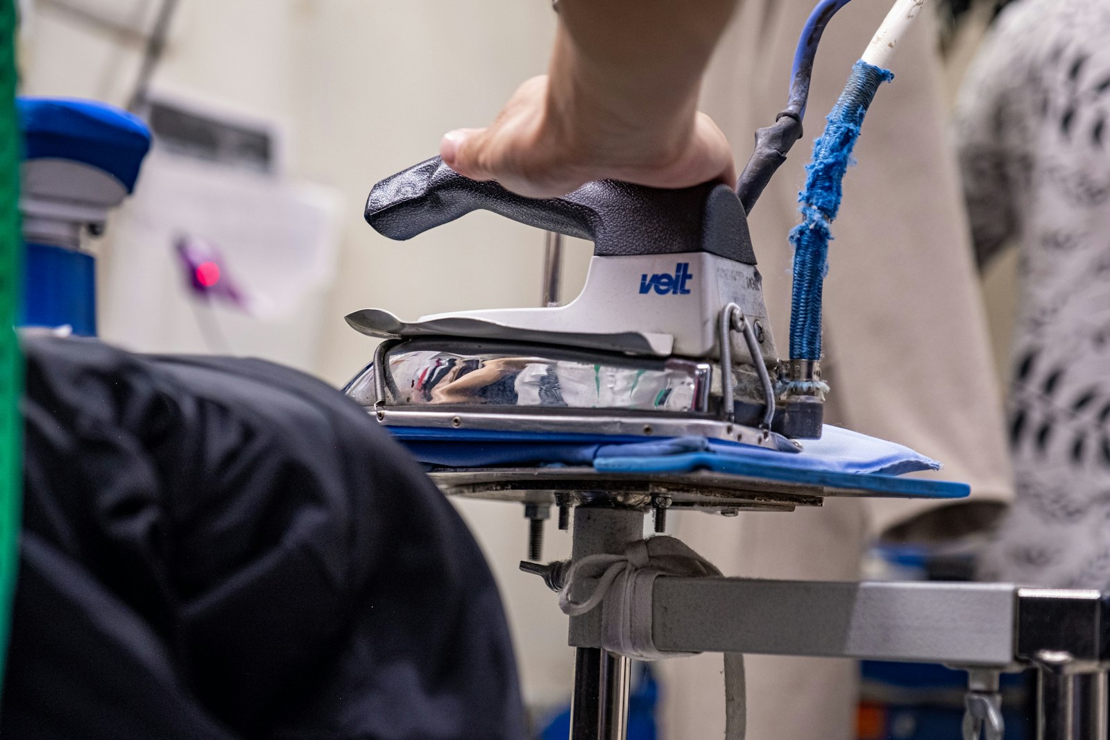 Shirt being ironed on an ironing board - Dora Ironing Service