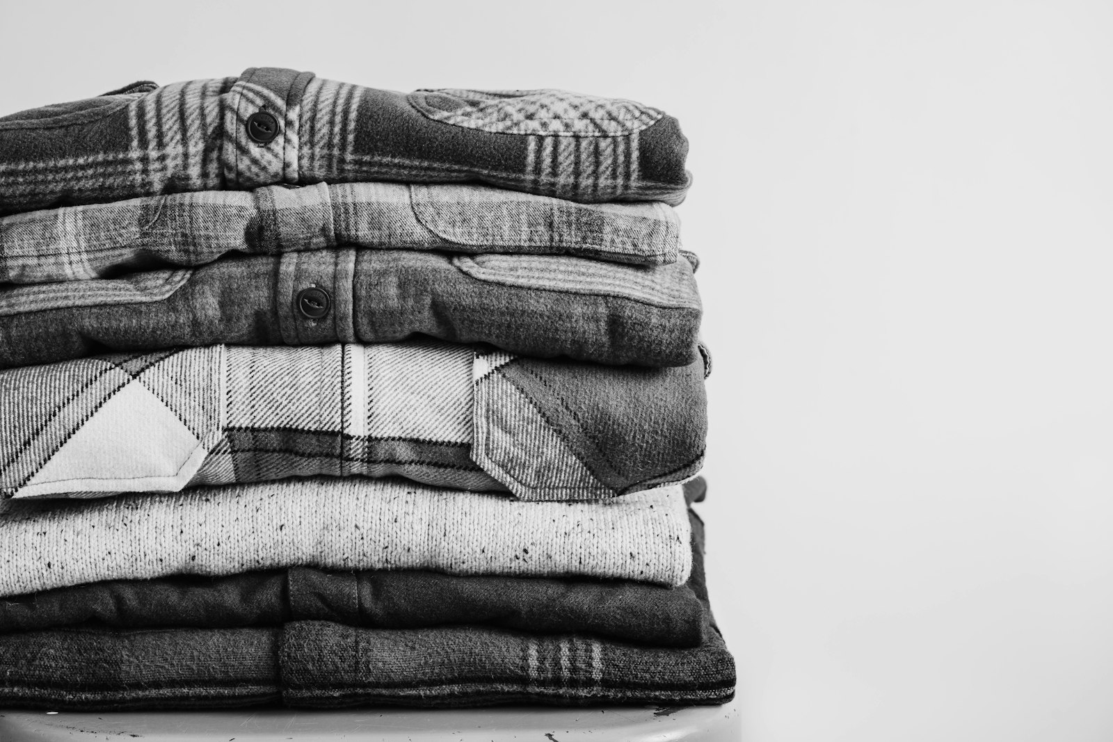 Stack of neatly folded shirts - Dora Ironing Service