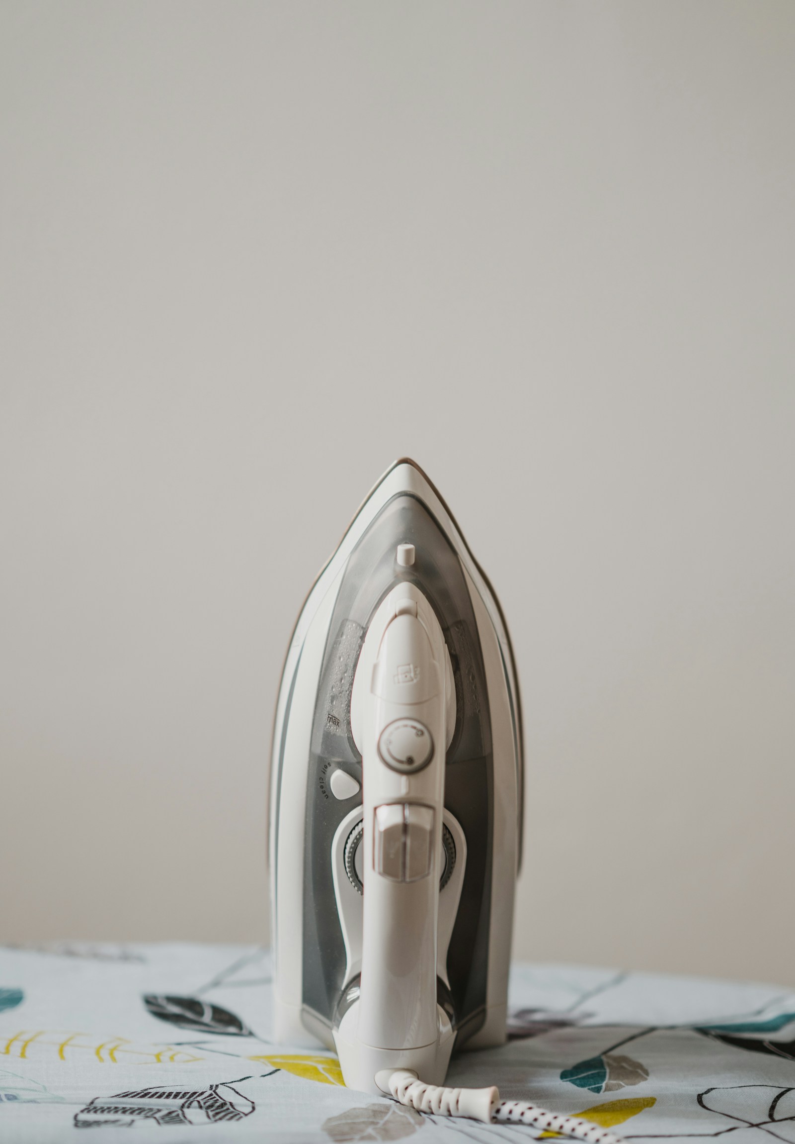 Steam iron on an ironing board