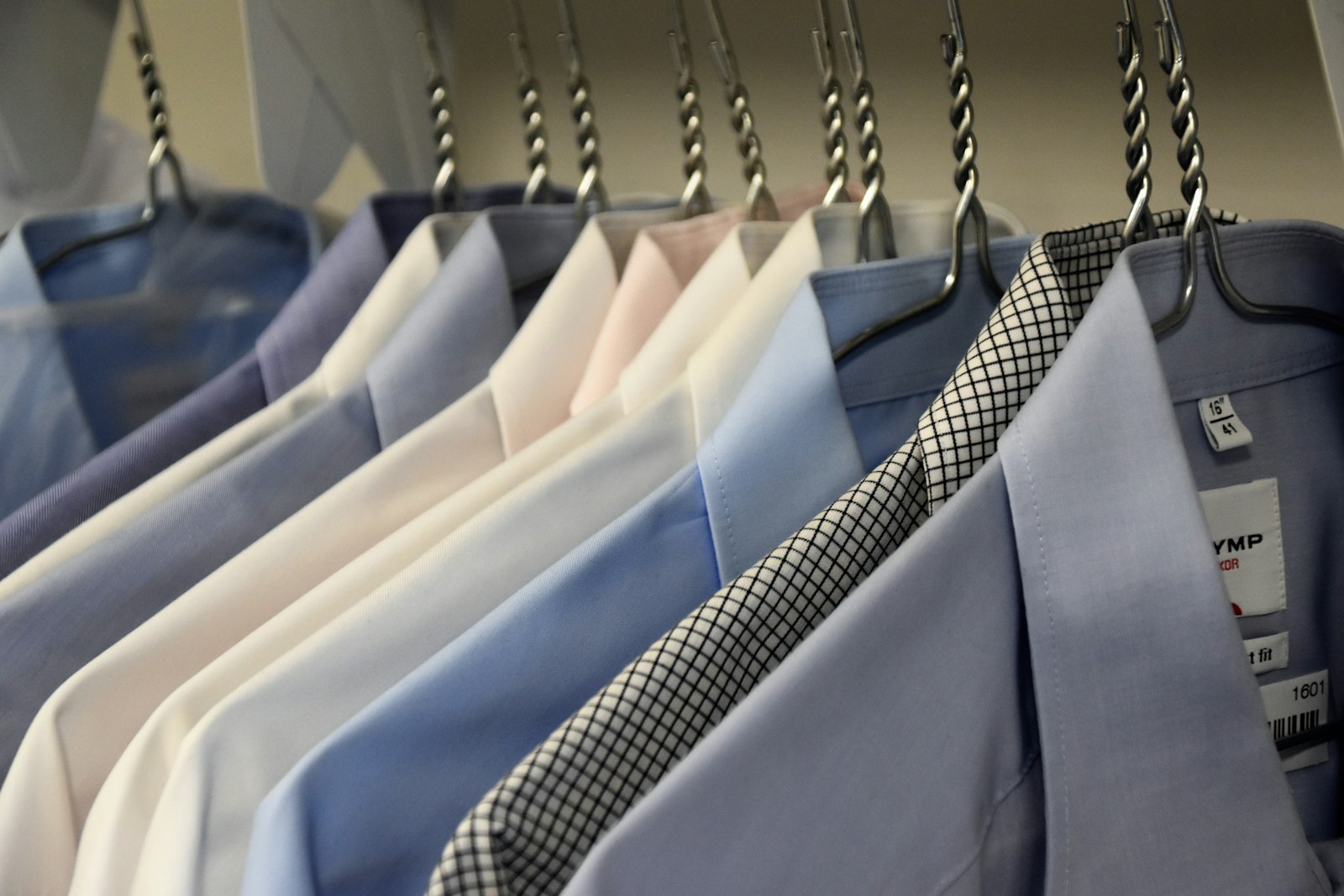 Suit jackets on hangers - Dora Ironing Service